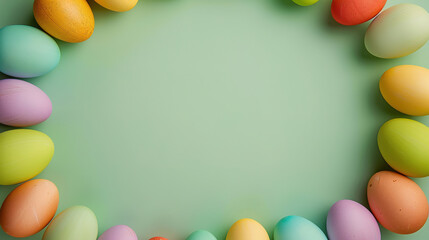 Naklejka na ściany i meble Easter wallpaper with colorful easter eggs on a green background with copy space