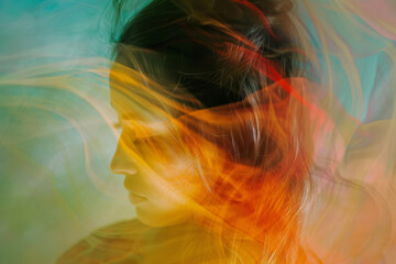 Abstract woman silhouette with vibrant color overlays - 747990610