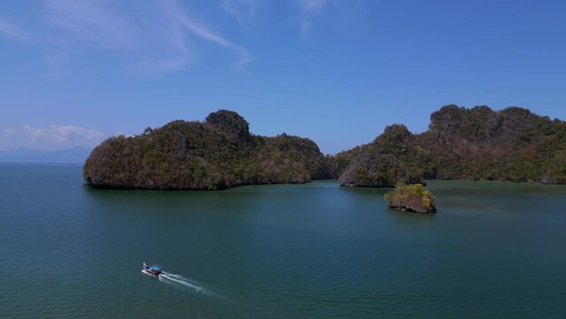 longtail boat Island at sandy beach malysia Langkawi. Stunning aerial top view flight panorama overview drone
4k footage