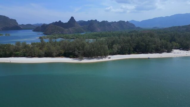 Island at sandy beach malysia Langkawi. Smooth aerial top view flight wide orbit overview drone
4k footage