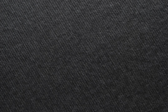 Black paper texture, a sheet of corrugated black color cardboard texture as background
