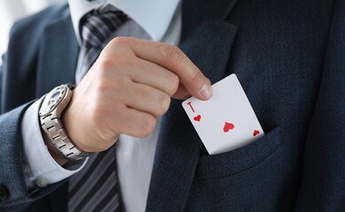 Man suit takes an ace card from his jacket pocket. One-sided advantage and benefit. Technique or...