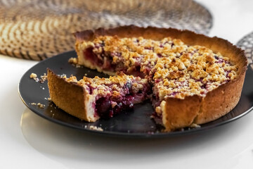 Cherry pie on a plate on the table. Photo