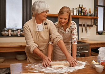 Mother, daughter and senior woman teaching baking, recipe or tips for bonding, love or dinner in...