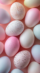 Easter eggs painted in pastel colors on a pink background.