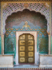 The colorful Rose gate at the City Palace of Jaipur in Rajasthan, India.