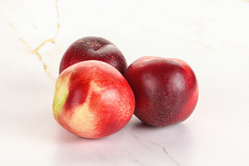 Ripe sweet juicy nectarines heap