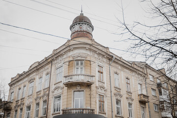 Ivano-Frankivsk, Ukraine. February 28, 2024, a small European city. incredibly beautiful historical architecture. red and orange roofs of houses.the weather is warm, people are walking around the city