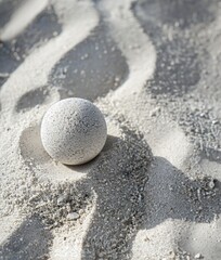 Fototapeta na wymiar White stone on the sand of the beach, close-up.