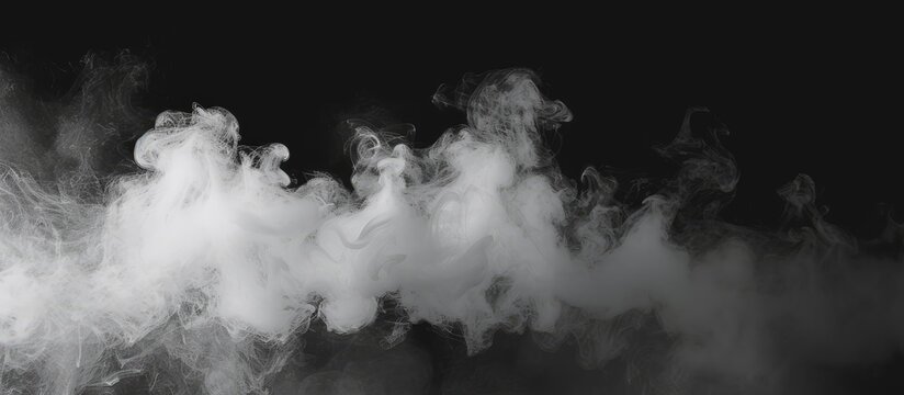 This black and white image showcases billowing smoke creating abstract patterns against a stark black backdrop. The smoke appears to have a sense of movement and depth as it disperses in the air.