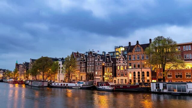 Amsterdam Netherlands time lapse city skyline night at canal waterfront