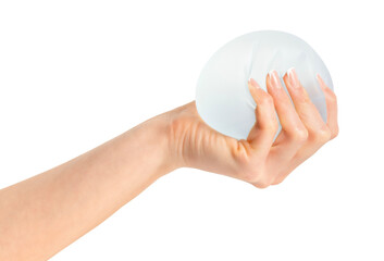 Female hand squeezing soft round breast implant - obrazy, fototapety, plakaty