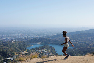 Sexy and Fit African American Woman Wearing Sports Outfit While Hiking in Hollywood, Los Angeles in...