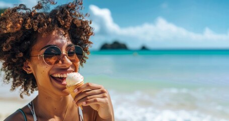 Close up of young african american woman smiling happy on a summer day by the beach eating a ice cream