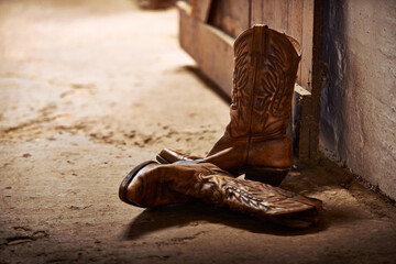 Cowboy boots, ranch and style at farm for walking, safety and retro fashion on floor, ground and...
