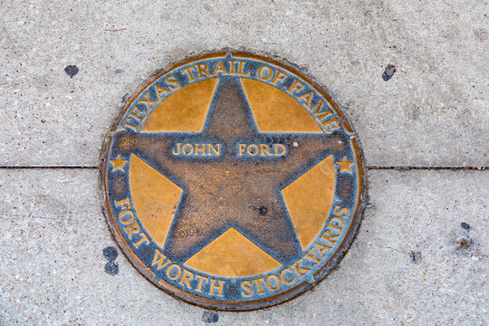 texas trail of fame honors Johm Ford with a plate at wolk of fame in Fort Worth Stockyards