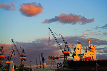 Large container ships at the Container Terminal Buchardkai in Hamburg, Germany are being loaded...