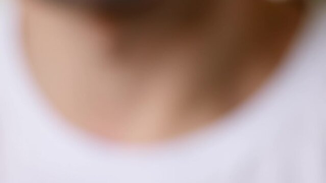 Cut finger with a sharp knife and drawn eyes. A funny safety reminder. Close-up of a thumb with a wound. LIKE