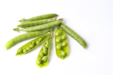 Ripe green peas on a white background.