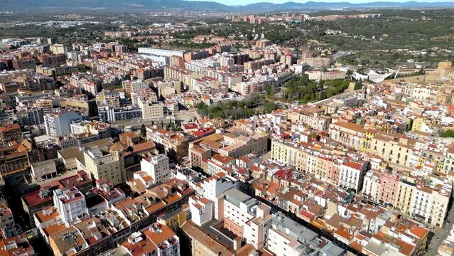 Rooftops of Tarragona. Drone passing forward above the city center. Medieval and historic city, famous for the Castells competition and festival. Sunny day. 