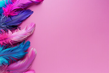 Vibrant feathers artistically arranged against a clean pink background, providing plenty of space for additional design elements. Perfect for projects related to crafts, fashion, or decor