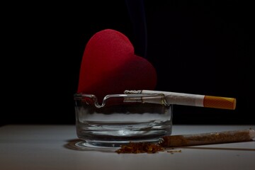 smoking destroys a red heart harmful to health