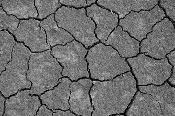 Wall texture soil dry crack pattern of drought lack of water of nature brown old broken background.