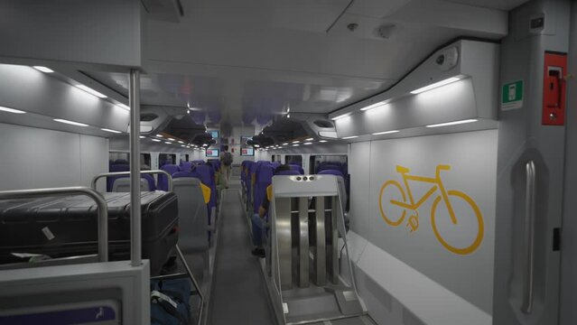 The interior of a modern double-decker Trenitalia Hitachi Caravaggio FNM train in Rome, Italy. Inside view of the new contemporary two-decker electric railway vehicle Hitachi Rail Italy 