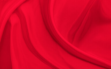 Black red satin dark fabric texture luxurious shiny that is abstract silk cloth background with patterns soft waves blur beautiful.