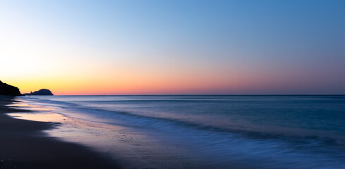 Fototapeta na wymiar Sunrise on Yanıklı beach and waves with long exposure