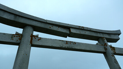 Stone Japanese Arch. Clip. Stone arch in Chinese style on background cloudy sky. Close-up of part...