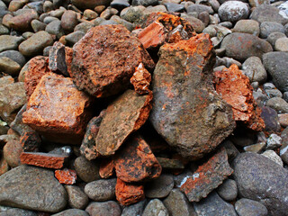 Close-up of brick fragments on the gravel. 