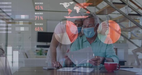 Animation of financial data processing over senior caucasian couple wearing face masks - Powered by Adobe