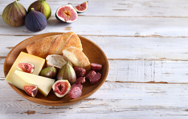 baguette with cheese and fresh fruit for snack