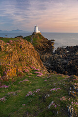 The majestic Twr Mawr lighthouse at sunset on the island of Ynys Llanddwyn in Anglesey, North Wales.