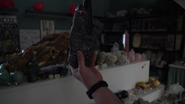 glowing stone. Opal. The stone glows under ultraviolet light. Geology. Geologic findings. Excavation. Rare stone. Rock.