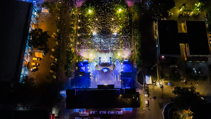 People at night open air concert aerial view