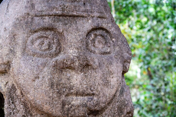 Closeup of the face of an ancient statue in San Agustin, Colombia - 748100638