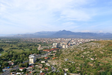 Obraz premium View of a valley with a rural settlement from the ancient stone wall of Rozafa Castle in Shkoder, Albania