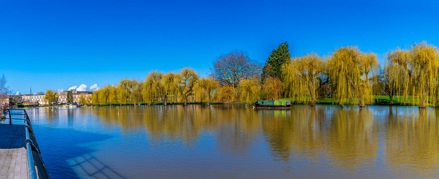 A panorama view down the River Nene into the city in Peterborough, UK on a bright sunny day