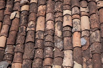 Broken and mossy tile roof