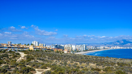 Fototapeta na wymiar Cityscape and skyline of buildings in San Juan Beach, Alicante, Spain