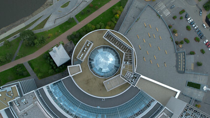 Top view of modern round building with dome. Stock footage. Beautiful architecture of business...