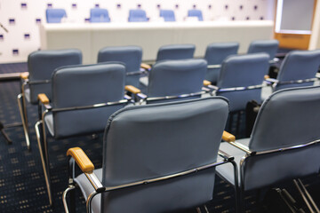 Empty modern conference hall, venue for congress lecture, line row of chairs, auditorium for...