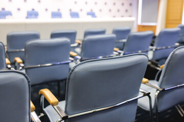 Empty modern conference hall, venue for congress lecture, line row of chairs, auditorium for...