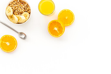 Bright breakfast with granola and orange juice on white background top view mockup