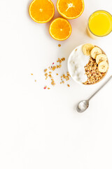 Bright breakfast with granola and orange juice on white background top view mockup