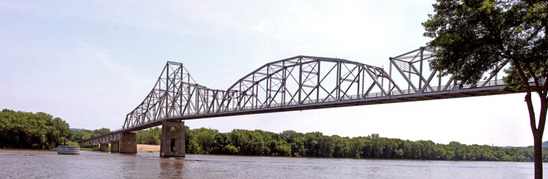 The Iowa DOT has temporarily closed the older iron truss, Black Hawk Bridge spanning the Mississippi River, joining Lansing IA, to Crawford County, WI. Wide panorama view from the North West in Iowa.