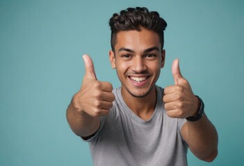 A joyful man in casual wear gives double thumbs up. His wide smile and exuberant vibe are infectious. - obrazy, fototapety, plakaty