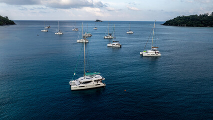 panoramic drone view of the coast of the Seychelles with bays and white catamarans